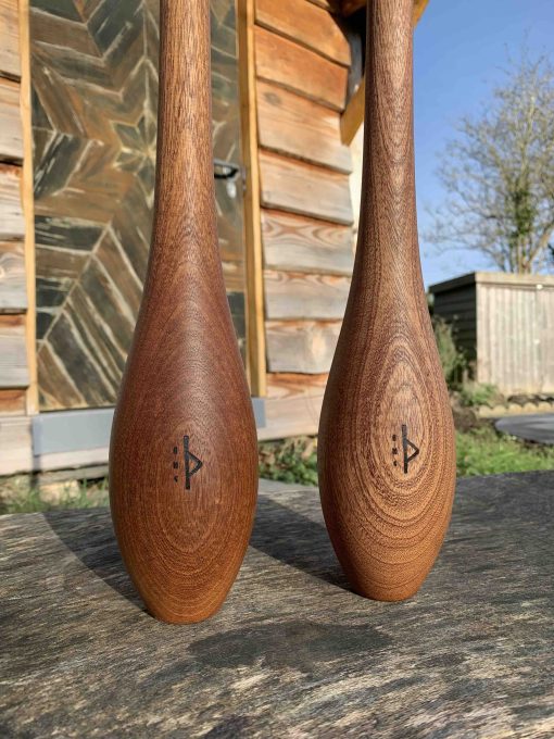 Close-Up-Pair-Of-Small-Wooden-Indian-Clubs-In-Garden