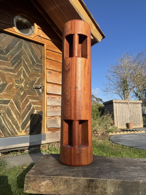 Large wooden sumtola made from sapele wood in a garden