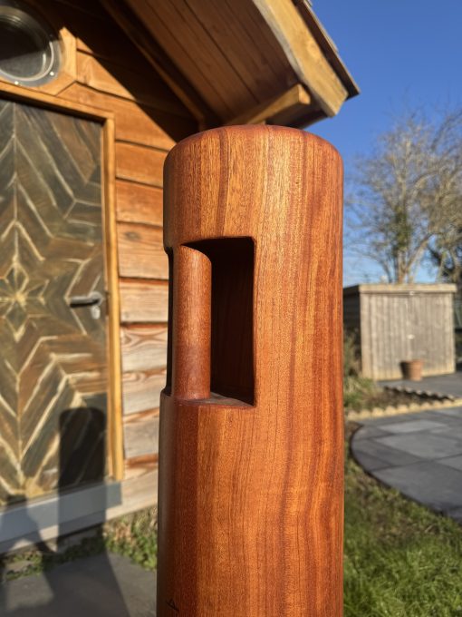 Close up of a Body Mind Fit sumtola made from sapele wood in a garden